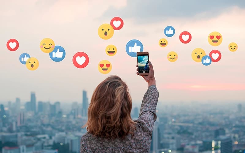 digital marketer with emojis in the sky
